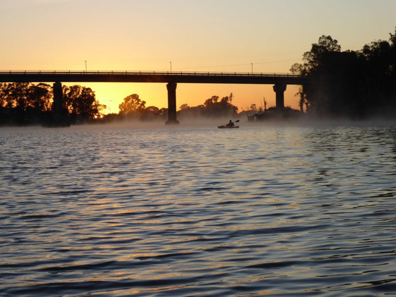 Sunrise at the Berri Bridge with kayaker