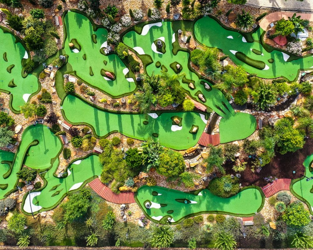 birds eye view of winding mini golf course.